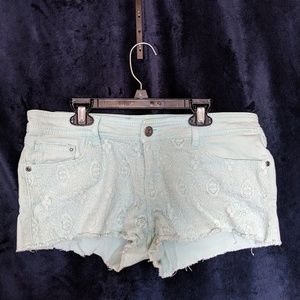 Pastel blue jean shorts.